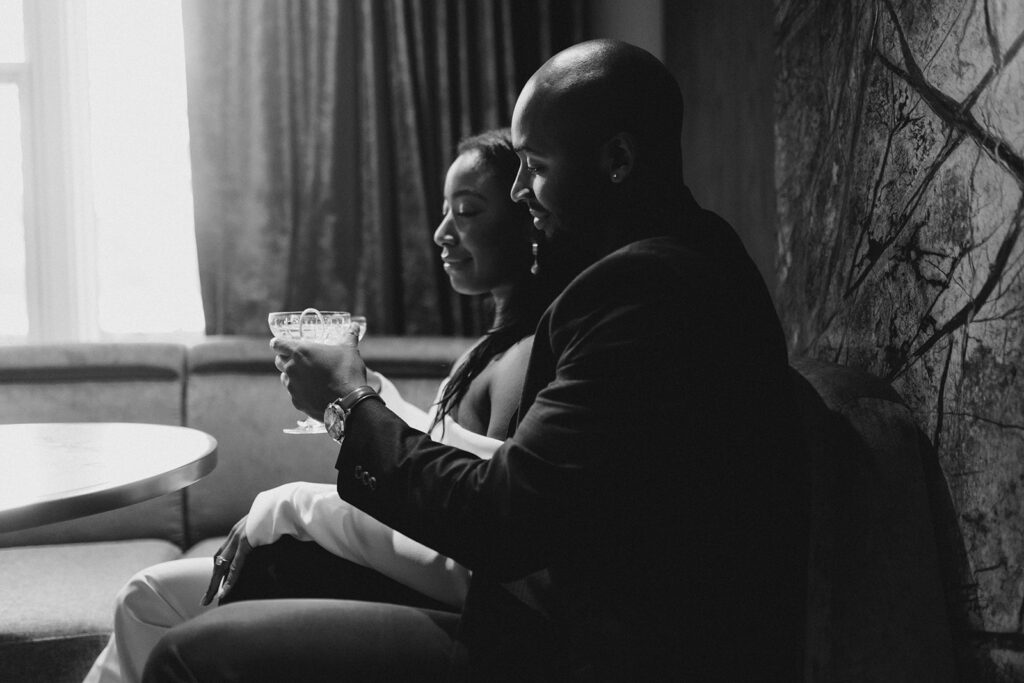 Savannah engagement session with couple enjoying drinks.