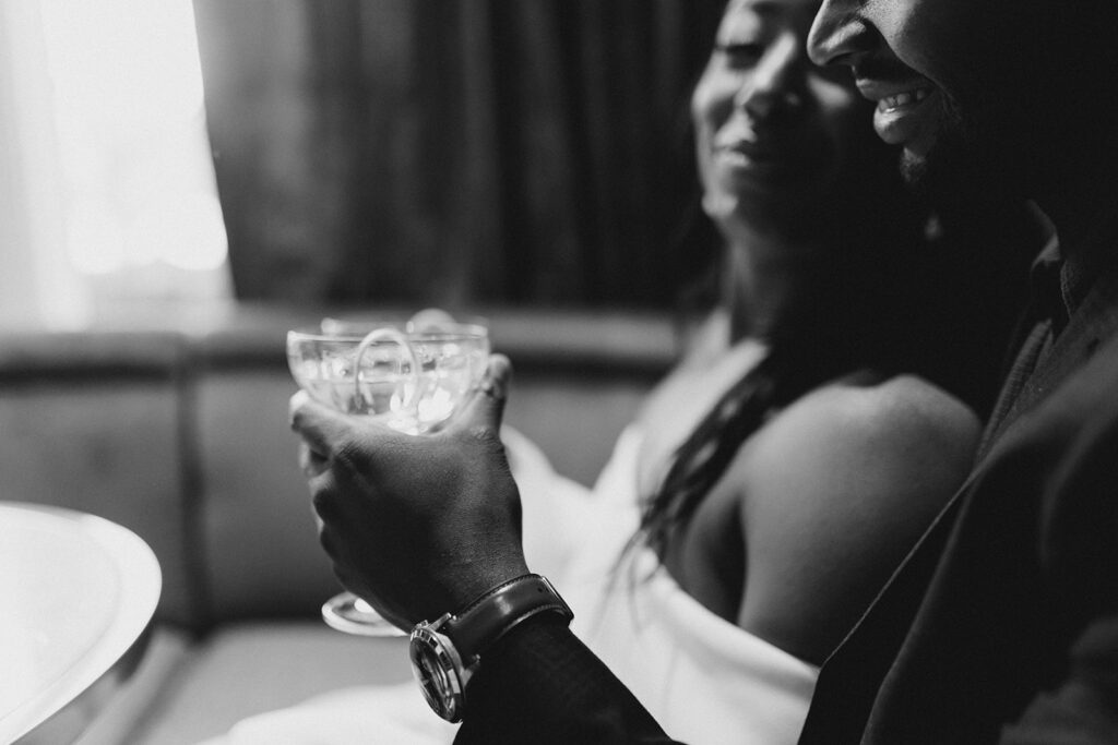 Savannah engagement session with couple enjoying drinks.