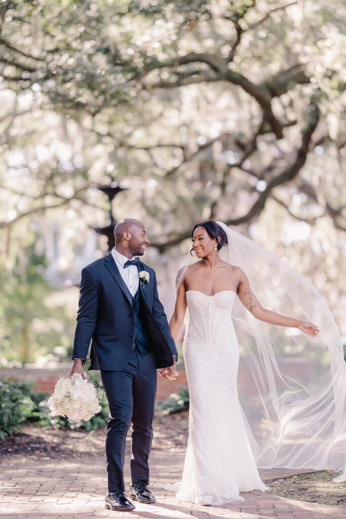 Bride and groom photos after wedding in Lafayette Square, Savannah.
