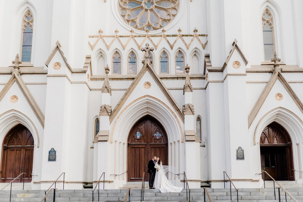 Bride and groom photo at St. John Cathedral close to Lafayette Square in Savannah.