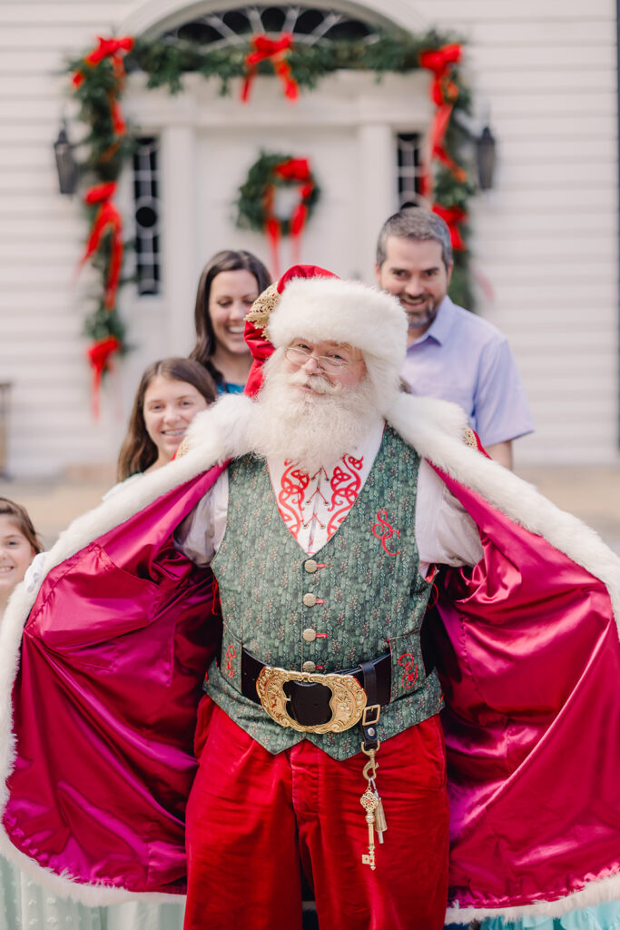 Santa shows off his attire. 