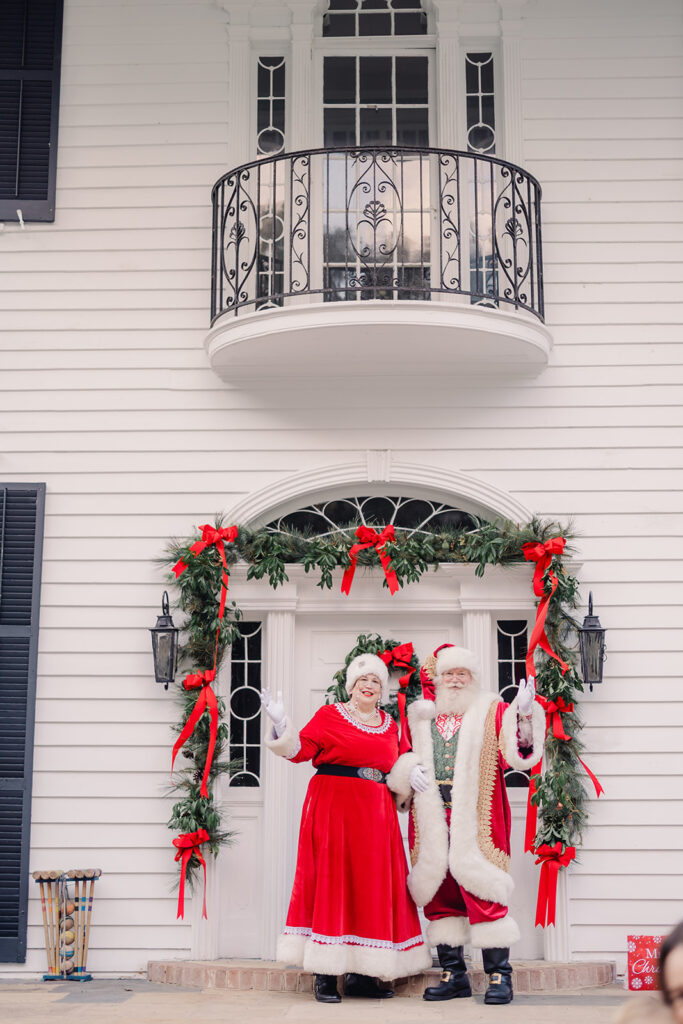 Santa and Mrs. Clause wave hello.