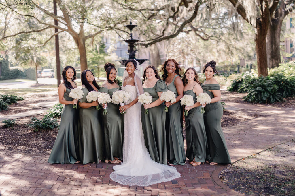 Fall wedding inspiration with bridesmaids in sage green dresses.