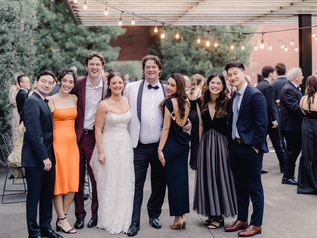 Wedding First Look - Bride and groom take photos with guests at cocktail hour.
